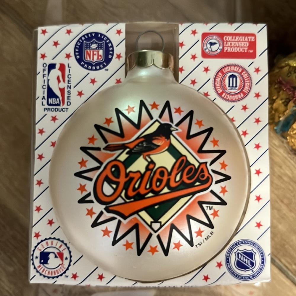 Collector’s Baltimore Orioles ornament. In original plastic. Silver-tone top.